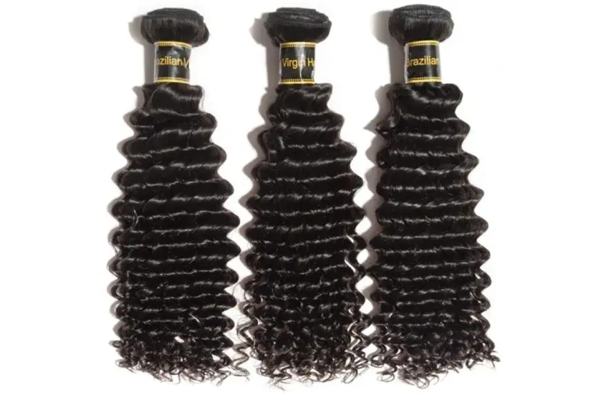 Three bundles of hair are laying next to each other.